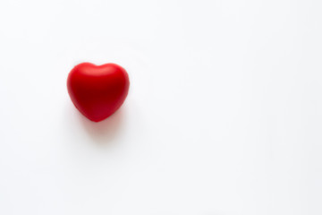 Close up red heart symbol of love isolated on white backgroound.  Hand holds red heart. St. Valentines day. Objecr photography. Health and cardiovascular risk of diseases. Cardiology news. 