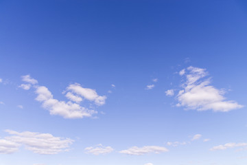 Blue sky and white fluffy tiny clouds background and pattern