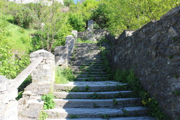 Ancient stone steps overgrown with grass