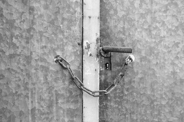 Metal door locked with chain