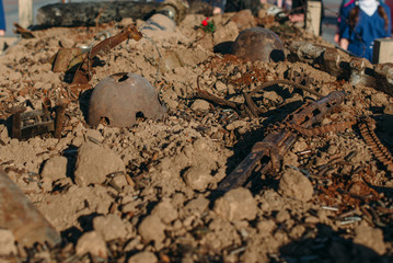 Leaky military helmet and used cartridges from the weapons.