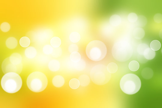 Abstract colorful gradient yellow green bokeh lights background texture.