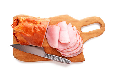 Delicious smoked sliced ham on a wooden board isolated on white.