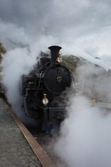 Fototapeta na wymiar Furka Dampflokomotive in Realp in der Schweiz