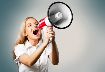 Portrait of woman holding megaphone, dressed in pin-up style