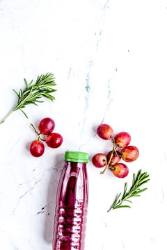 Grape Juice In Plastic Bottle On White Background Top View Mock-