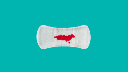 sanitary towel on turquoise background