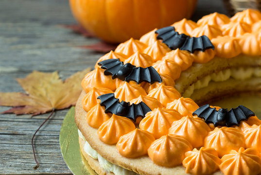A cake with orange cream and bats, the concept of Helluin.