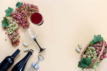 Red wine , grapes on a beige background