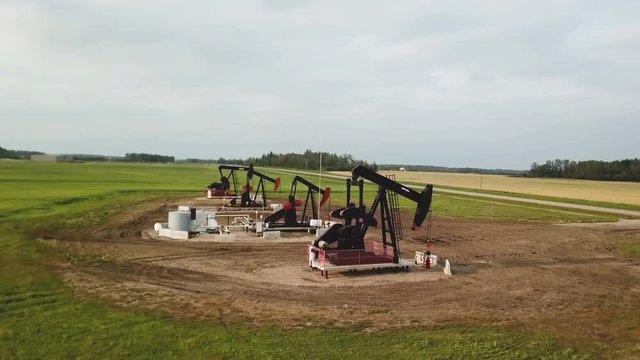 Aerial Drone Shot Flying over Alberta Oil Derricks, Alberta Canada, Prairie
