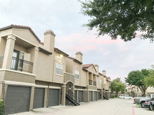Typical Apartment Complex Condos With Attached Garage And Uncovered Typical Apartment Complex Condos With Attached Garage And Uncovered Parking Lots At Suburban Area In Irving