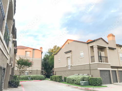 Typical Apartment Complex Condos With Attached Garage And Uncovered Typical Apartment Complex Condos With Attached Garage And Uncovered Parking Lots At Suburban Area In Irving Texas Usa