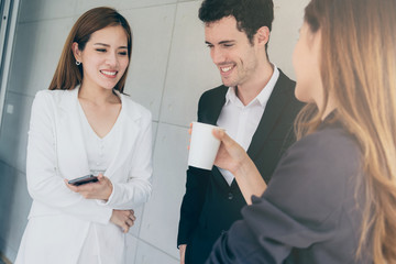 group of multination co worker relax conversation casual meeting brainstorm office background