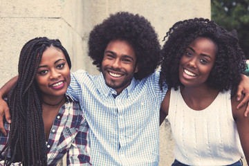 Laughing african american hipster man with two beautiful woman