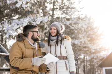 Couple taking photos with a tablet computer