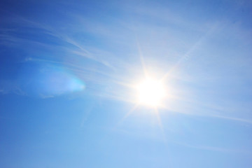 Blue Sky with Shining Sun Background, Bright Natural Image of Vibrant Blue Sky with No Clouds and...