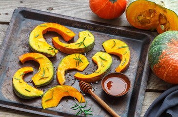 Pumpkin slices for baking with rosemary and honey. Healthy dessert for gourmets