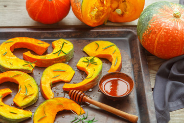 Pumpkin slices for baking with rosemary and honey. Healthy dessert for gourmets