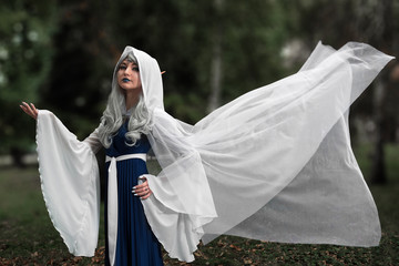 Girl cosplay elf in the park, autumn