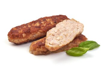 Fried long pork cutlets with basil leaves, isolated on white background.