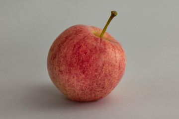 Pink apple isolated on gray color background