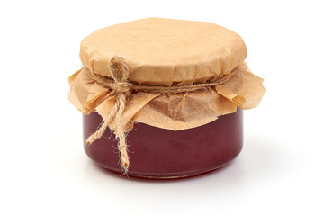 Plum jam glass jar isolated on white background
