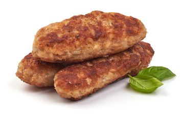 Fried long pork cutlets with basil leaves, isolated on white background.