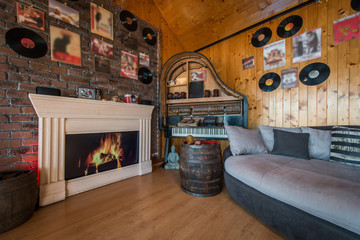 Comfortable seats and fireplace in cottage interior