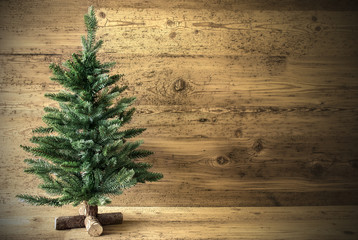 Green Christmas Tree On Brown Rustic Background