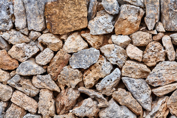 Old wall made of volcanic rough rocks, natural background or texture.