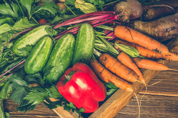 Bio organic vegetable. Farm fresh vegetables in the box on wooden background. - obrazy, fototapety, plakaty