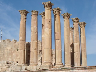 Columns of Roman civilization in the territory of modern Jordan on the background of blue sky.