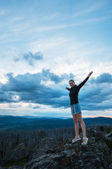 Fototapeta na wymiar Travel, lesure and freedom concept - woman on the top of Altai mountain, beauty summer evening landcape