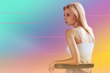 Professional photoshoot. Smart nice woman turning her back to you while sitting on the chair