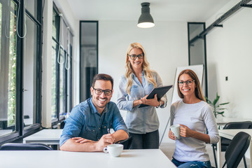 Portrait of a smiling casual business team.
