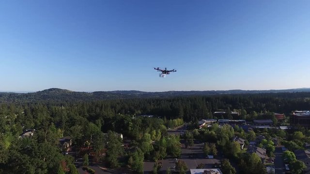 Drone Delivery with Package flying through Residential Neighbourhood