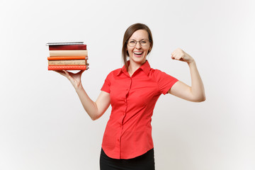 Portrait of strong business teacher woman in red shirt showing biceps muscles, holding stack text...