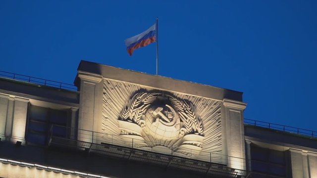 State flag of the Russian Federation over the State Duma, slow motion