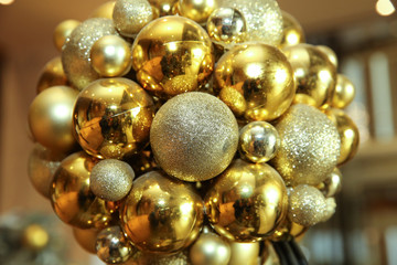 New Year background. New Year's round golden balls. Christmas balls close up picture. Three golden christmas sparkling balls against . Christmas Ball Decoration