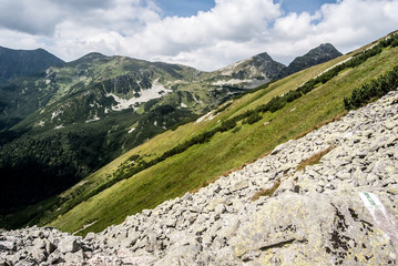 Fototapeta na wymiar Ostry Rohac, Placlive and Smrek peaks from hiking trail above Jamnicka dolina valley in Zapadne Tatry mountains in Slovakia