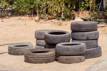 Old tires on the sand.