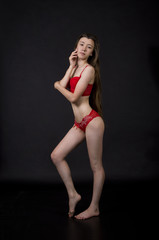 Fototapeta na wymiar Young woman in red underwear.
