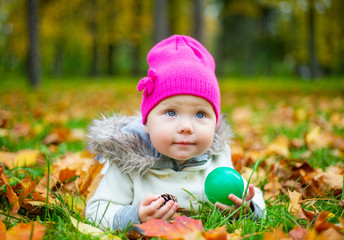 happy baby girl  in the autumn park