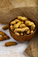 Peanuts in a wooden bowl