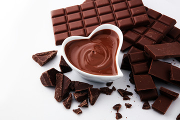 Melting chocolate or melted chocolate and chocolate swirl. stack and powder.