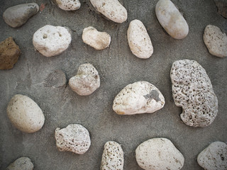 Stone smooth beach background in a concrete frame