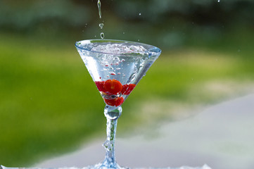 cocktail with water splash and fruit