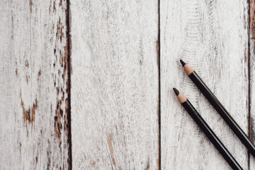 Group of color coal pencils on wooden background