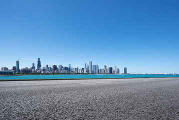 Naklejka premium asphalt highway with modern city in chicago
