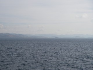 Obraz premium View on the green moutain, from the blue sea